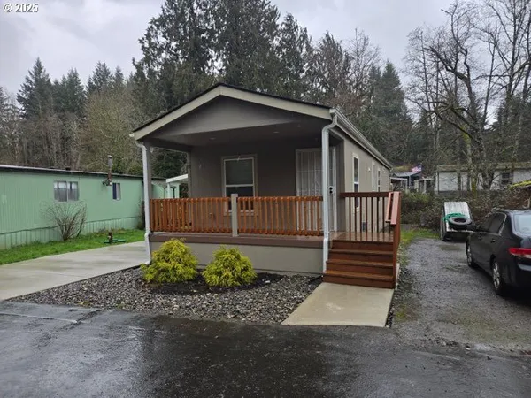 a front view of a house with yard and garage