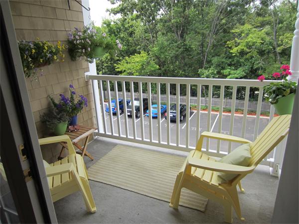 200 Chickering Road, Unit 306B North Andover, MA 01845 - Photo 16 of 30 a view of a chair and tables in the balcony