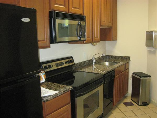 200 Chickering Road, Unit 306B North Andover, MA 01845 - Photo 28 of 30 a kitchen with a stove and a microwave