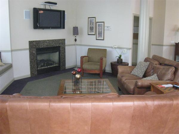 200 Chickering Road, Unit 306B North Andover, MA 01845 - Photo 29 of 30 a living room with furniture and a fireplace