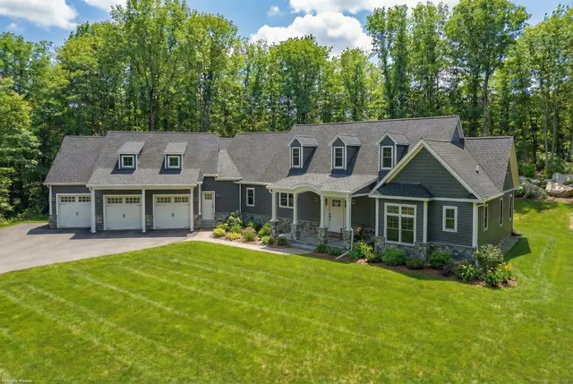 front view of a house with a yard