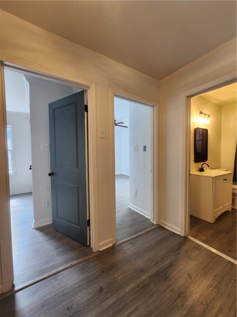4818 Lansdown Drive Corpus Christi, TX 78411 - Photo 6 of 9 a view of a hallway with wooden floor and a living room