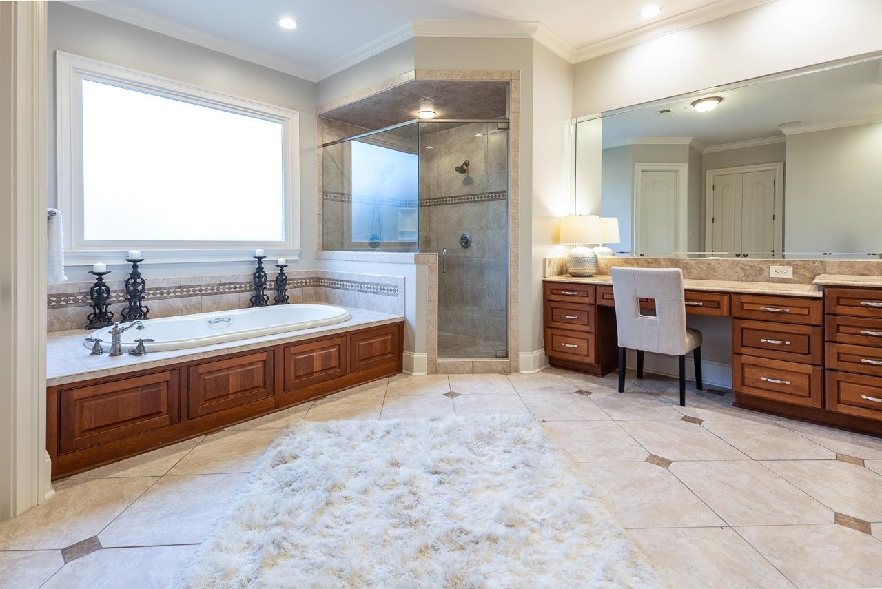 9844 Legends Drive Collierville, TN 38139 - Photo 13 of 25 a large bathroom with double vanity and a large mirror