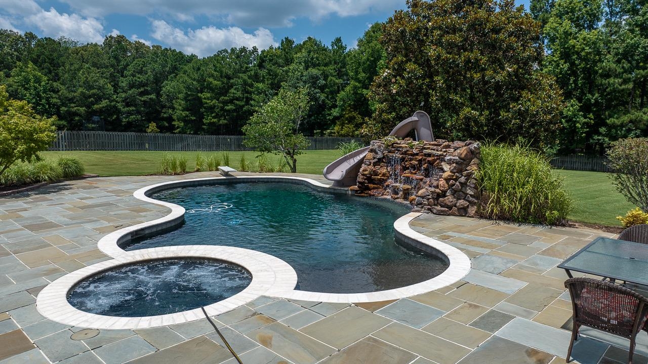 9844 Legends Drive Collierville, TN 38139 - Photo 18 of 25 a view of a swimming pool with a yard