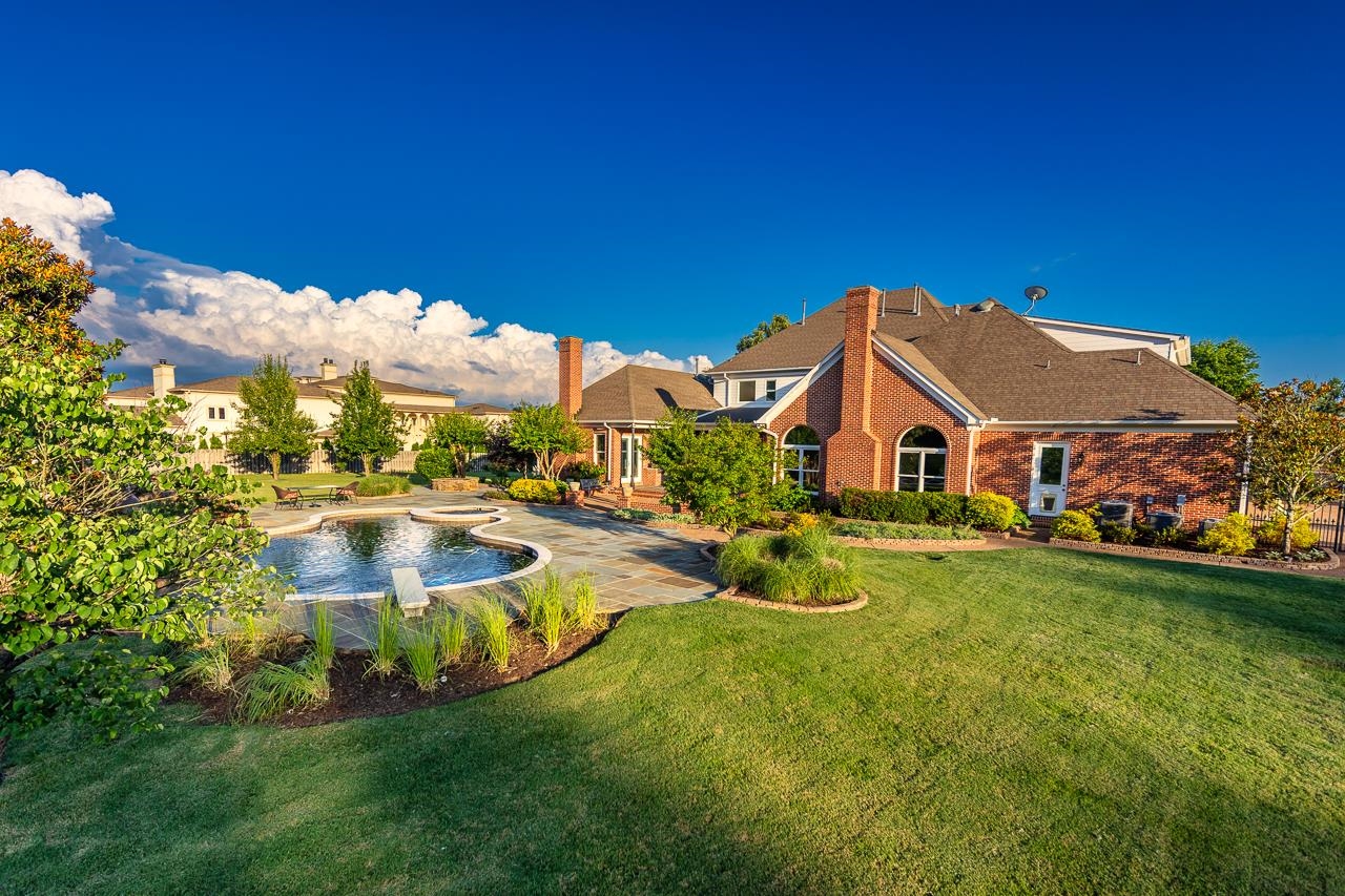 9844 Legends Drive Collierville, TN 38139 - Photo 19 of 25 a aerial view of a house with swimming pool and a yard