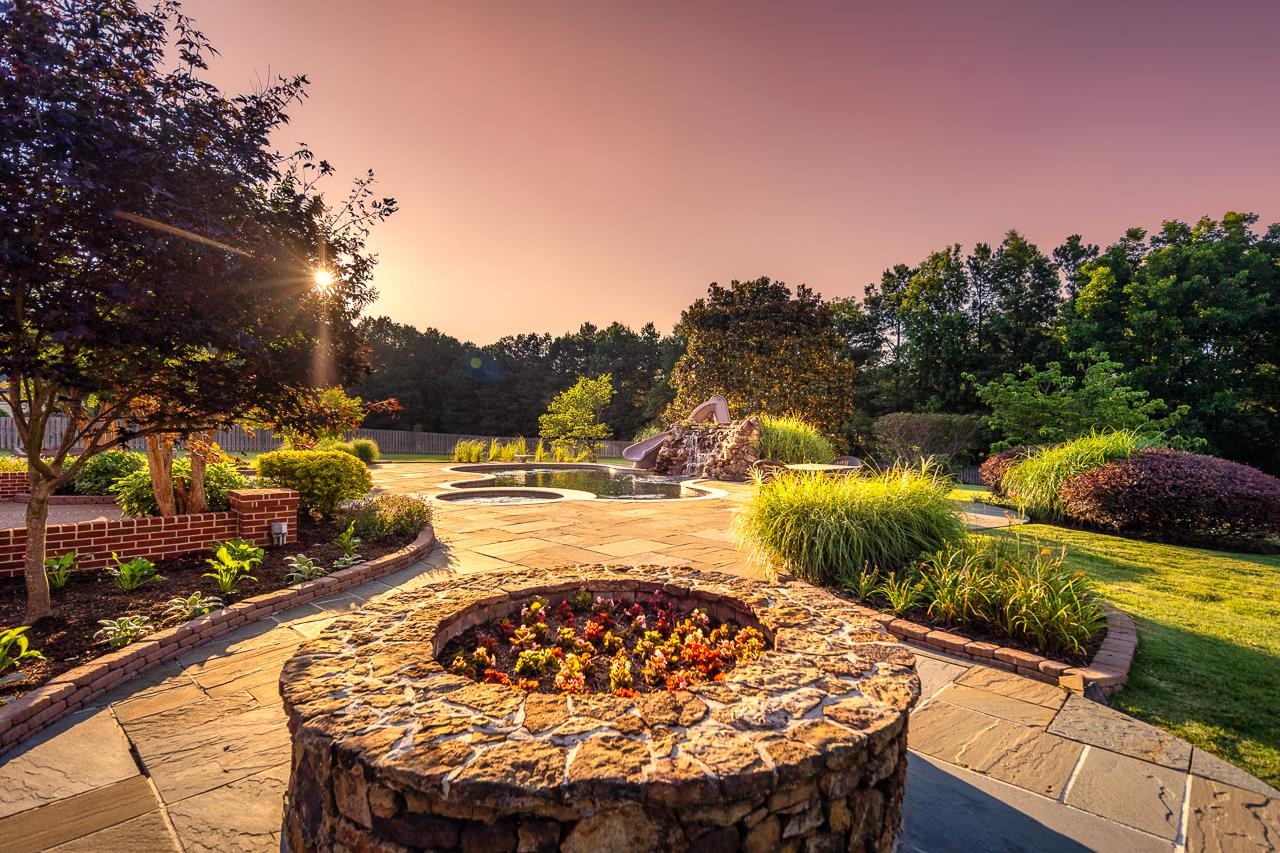 9844 Legends Drive Collierville, TN 38139 - Photo 20 of 25 a view of a swimming pool with a patio and a yard