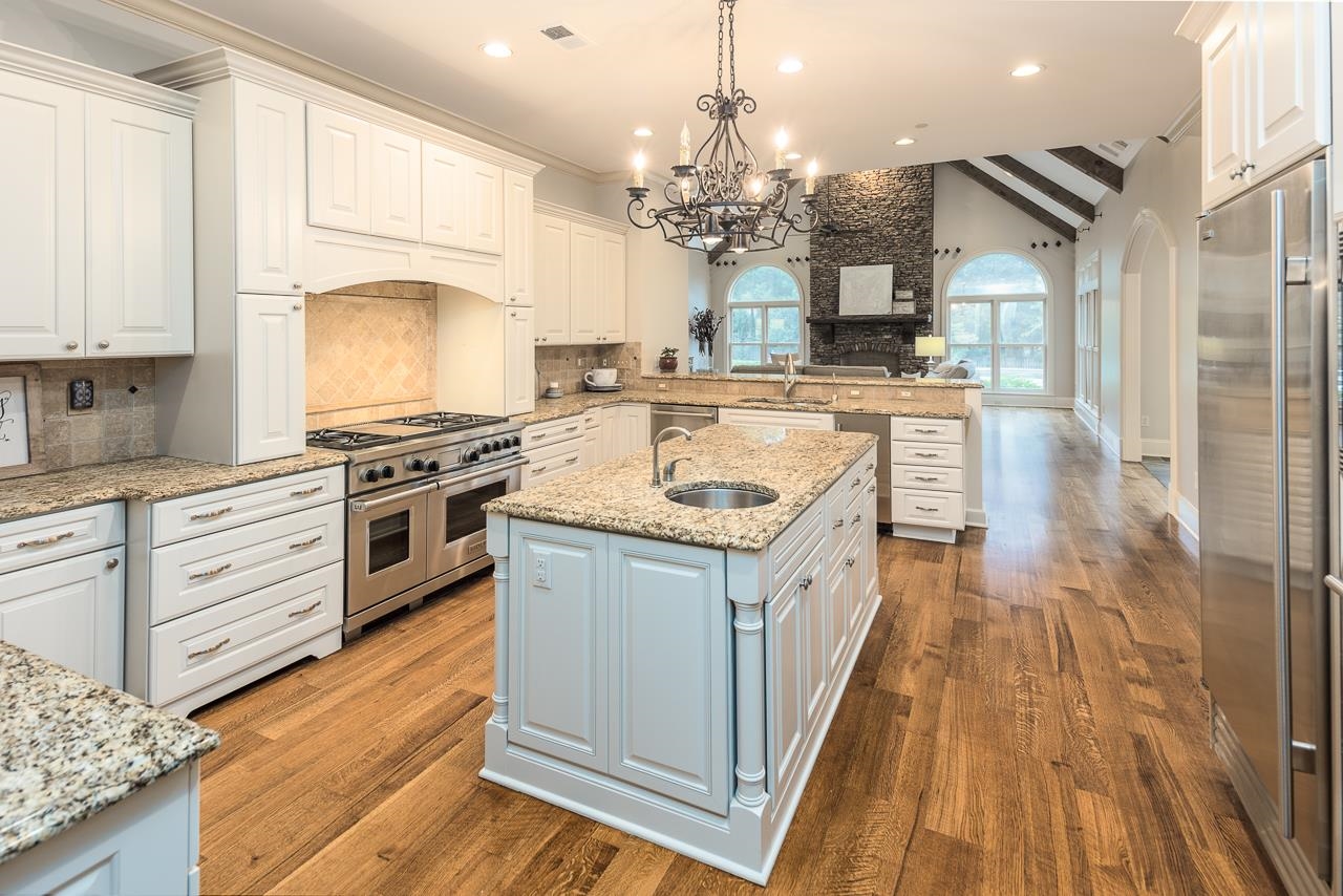 9844 Legends Drive Collierville, TN 38139 - Photo 2 of 25 a kitchen with stainless steel appliances granite countertop a sink and cabinets