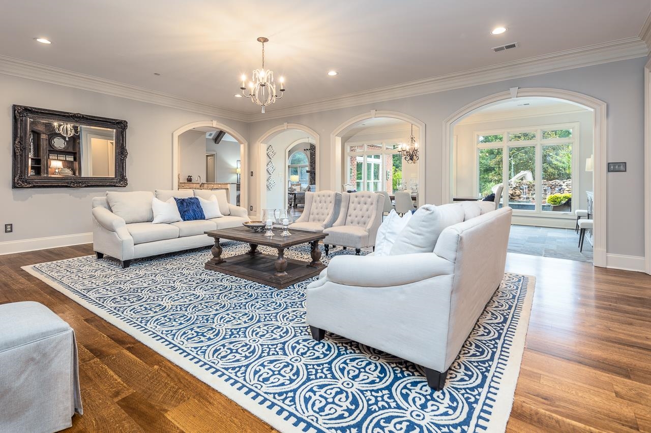 9844 Legends Drive Collierville, TN 38139 - Photo 8 of 25 a living room with furniture and a chandelier