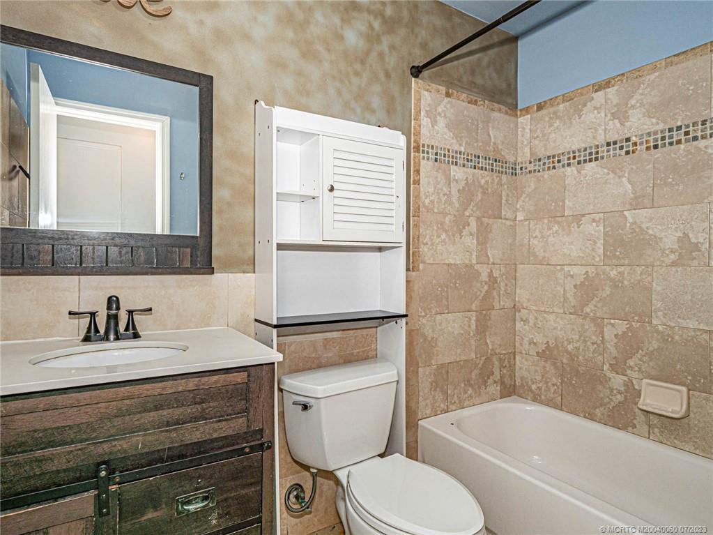 662 Southeast Ron Rico Terrace Port St. Lucie, FL 34983 - Photo 17 of 27 a bathroom with a sink toilet and shower