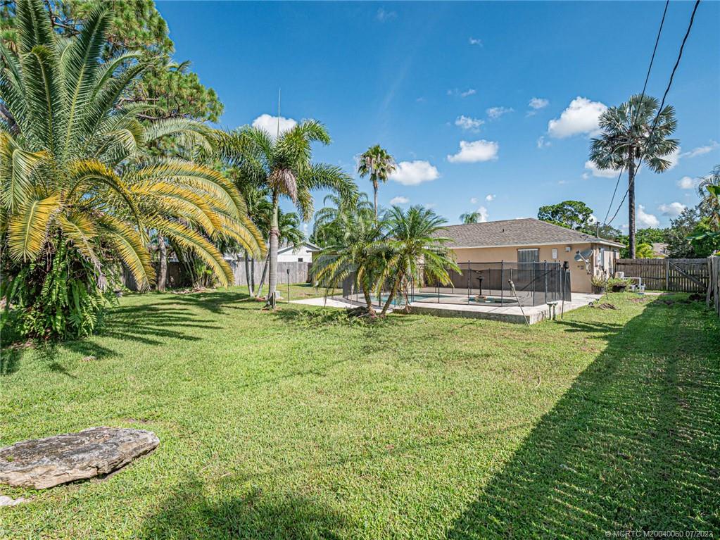 662 Southeast Ron Rico Terrace Port St. Lucie, FL 34983 - Photo 3 of 27 a view of a house with a garden