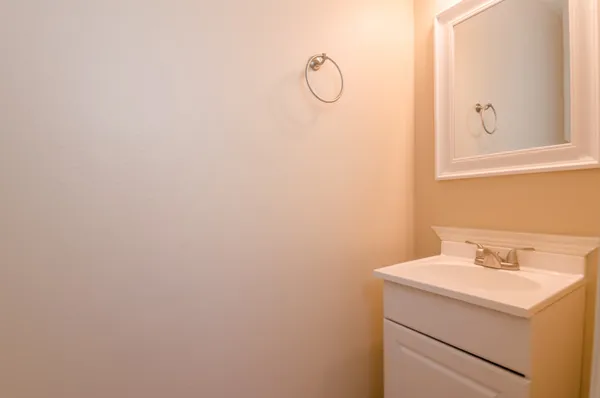 a bathroom with a sink and vanity