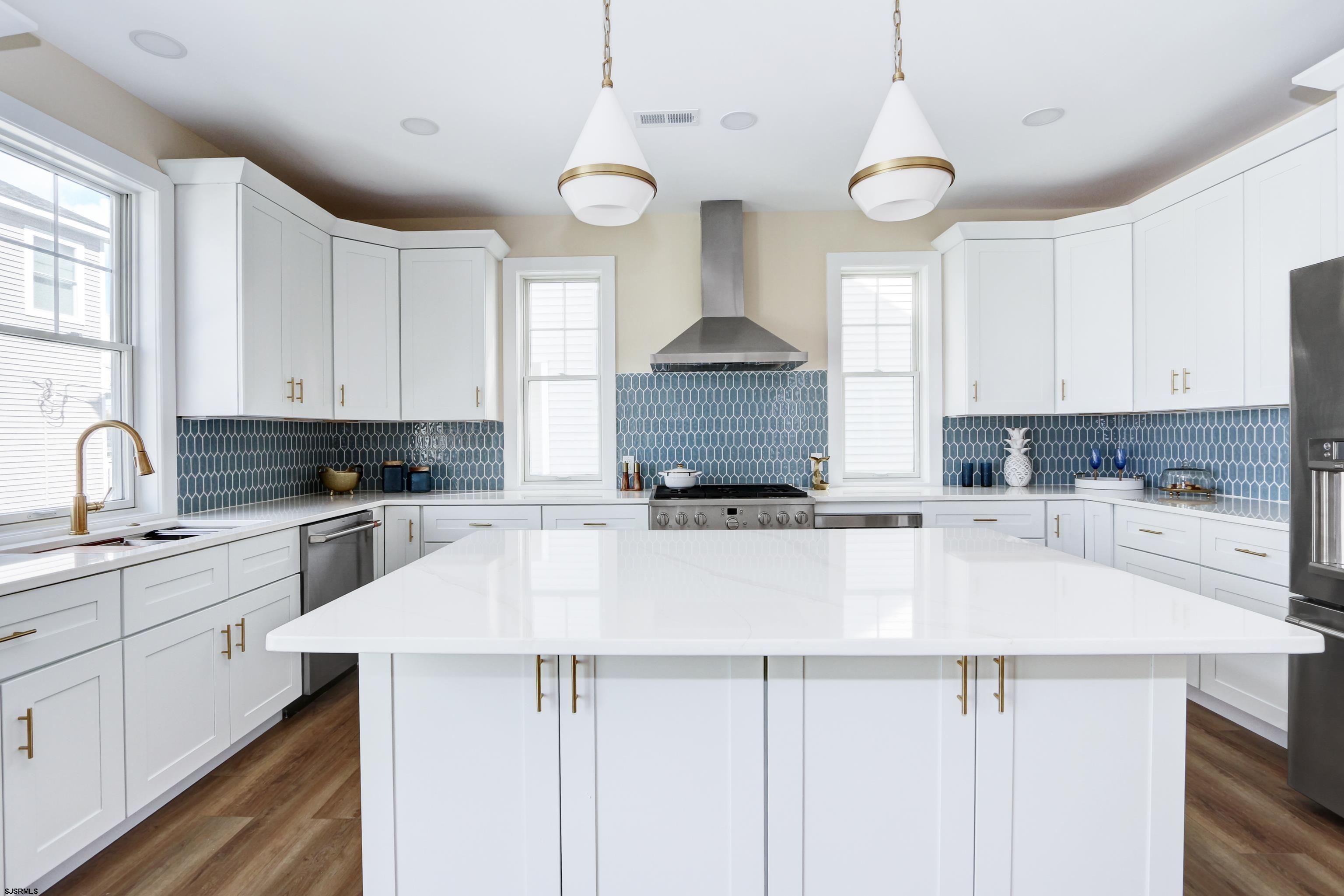 303 Lafayette Place Brigantine, NJ 08203 - Photo 12 of 38 a kitchen with a sink cabinets and window