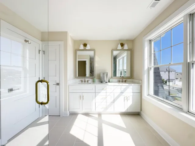 a bathroom with a tub sink and shower
