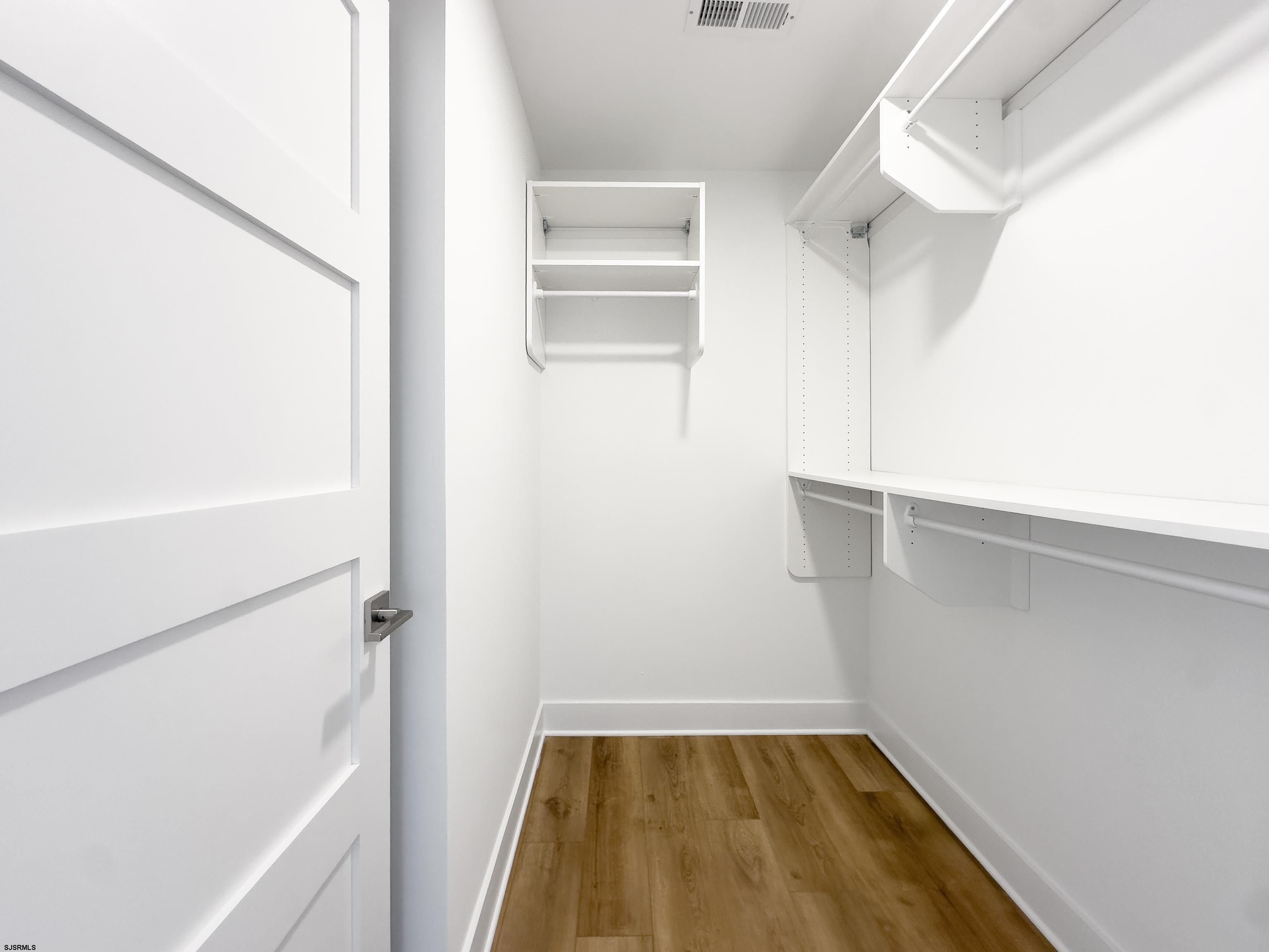 303 Lafayette Place Brigantine, NJ 08203 - Photo 23 of 38 a view of walk in closet with empty racks