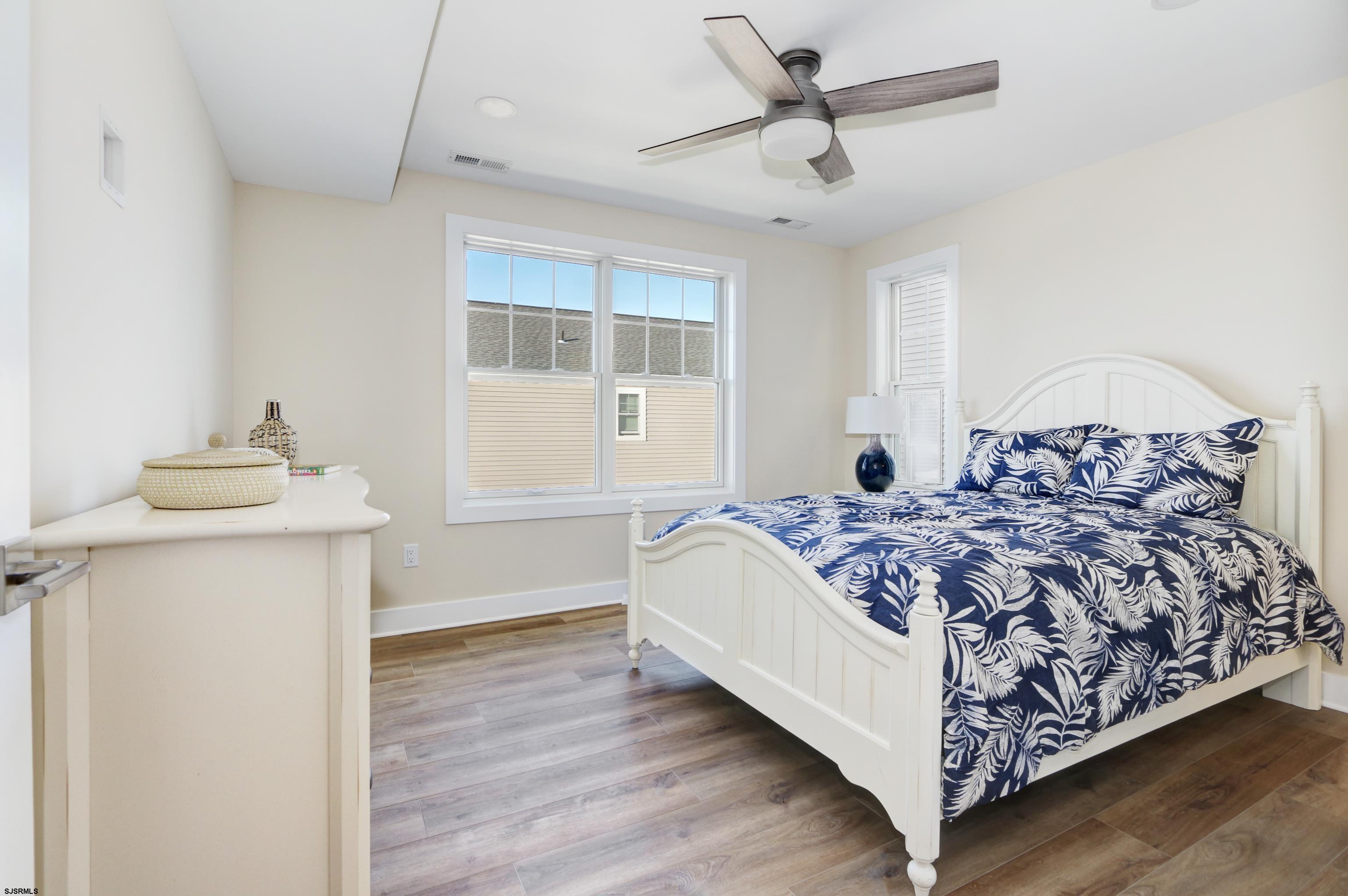 303 Lafayette Place Brigantine, NJ 08203 - Photo 26 of 38 a bed room with a bed and a window