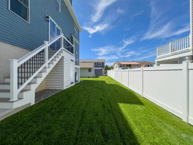 a view of an house with backyard and a tv