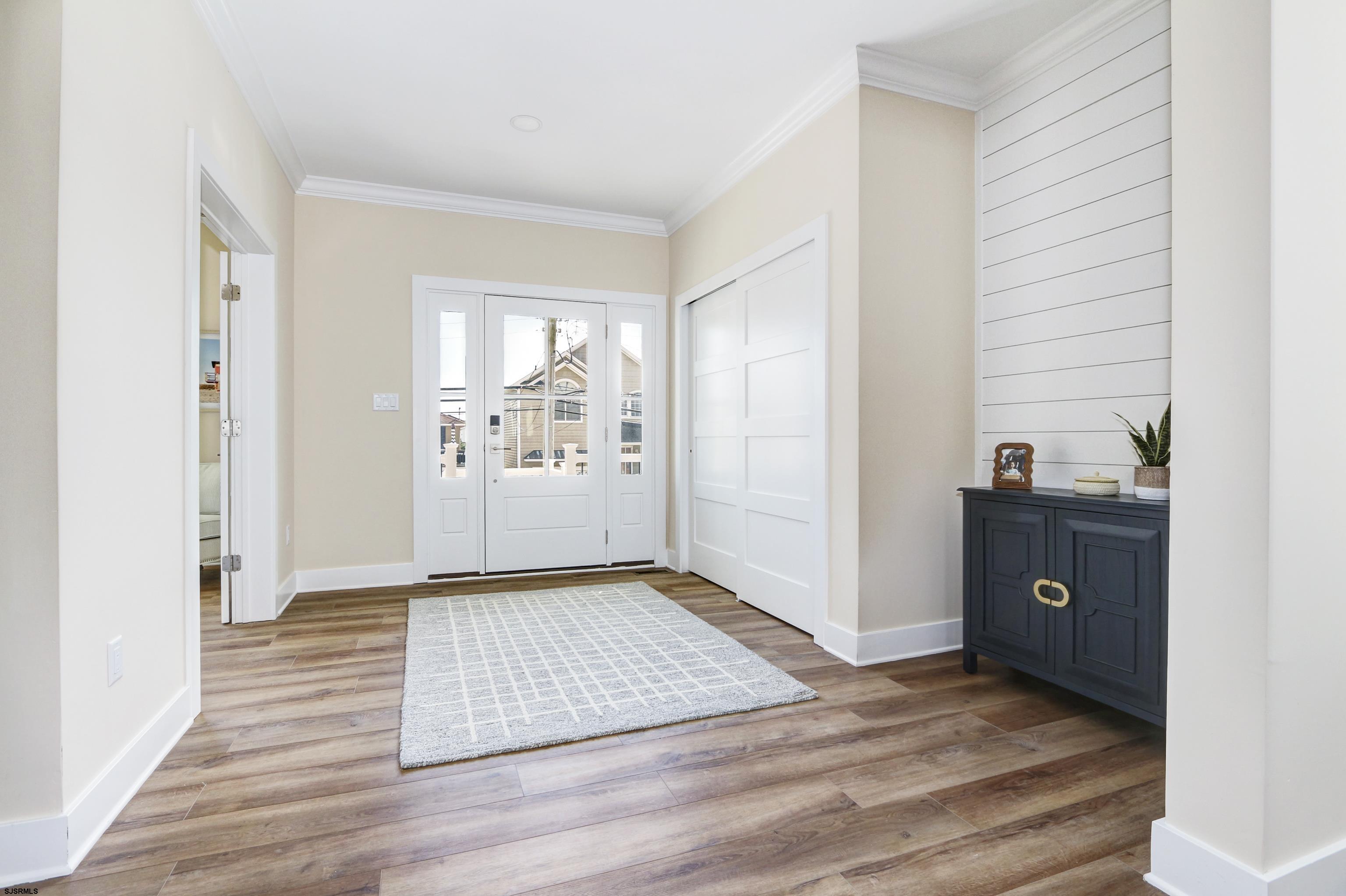 303 Lafayette Place Brigantine, NJ 08203 - Photo 5 of 38 a view of a livingroom with wooden floor