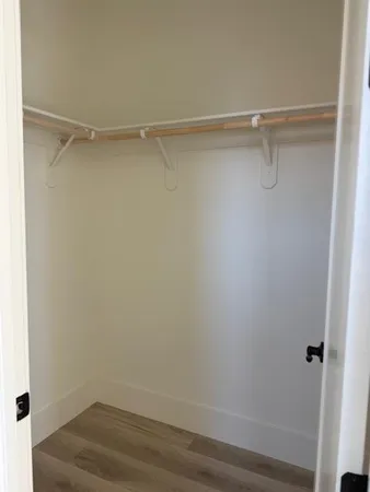 a view of an empty walk in closet