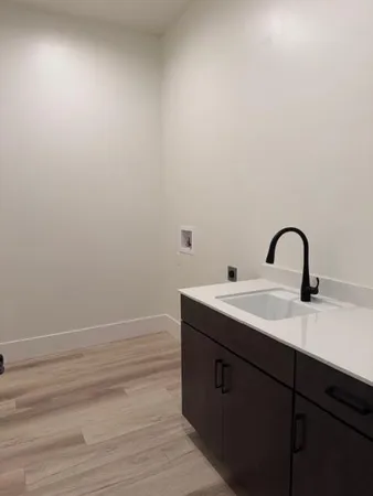a bathroom with a sink and mirror