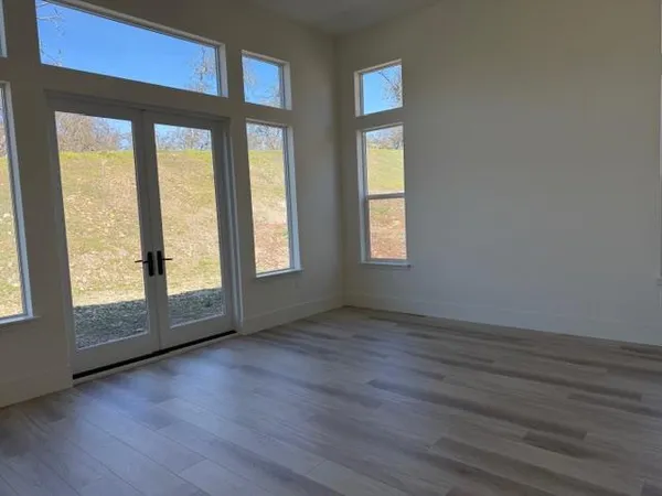 a bathroom with a double vanity sink and mirror