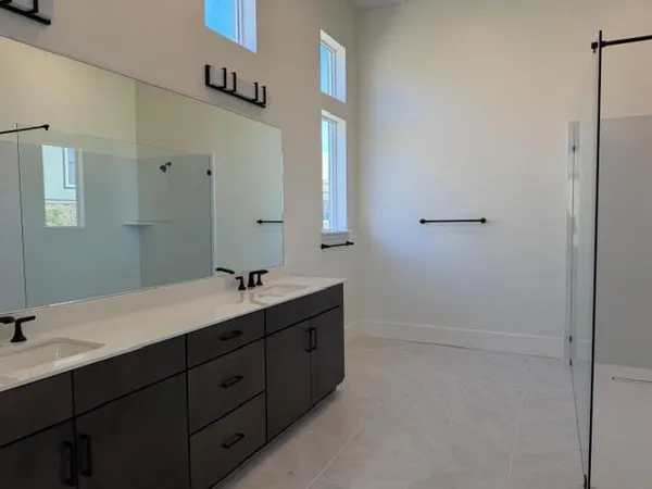 a white toilet sitting next to a shower
