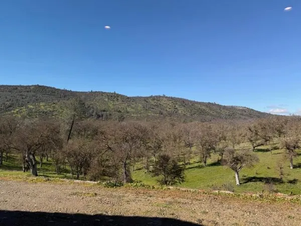 a view of mountain with sunset