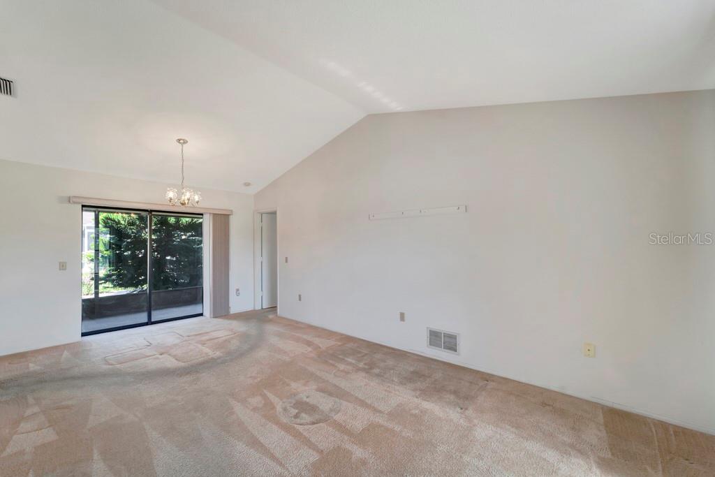 5861 Adams Road Venice, FL 34293 - Photo 15 of 51 Dining Room has a sliding Door to the Lanai