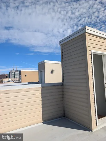 an empty room with wooden floor and closet