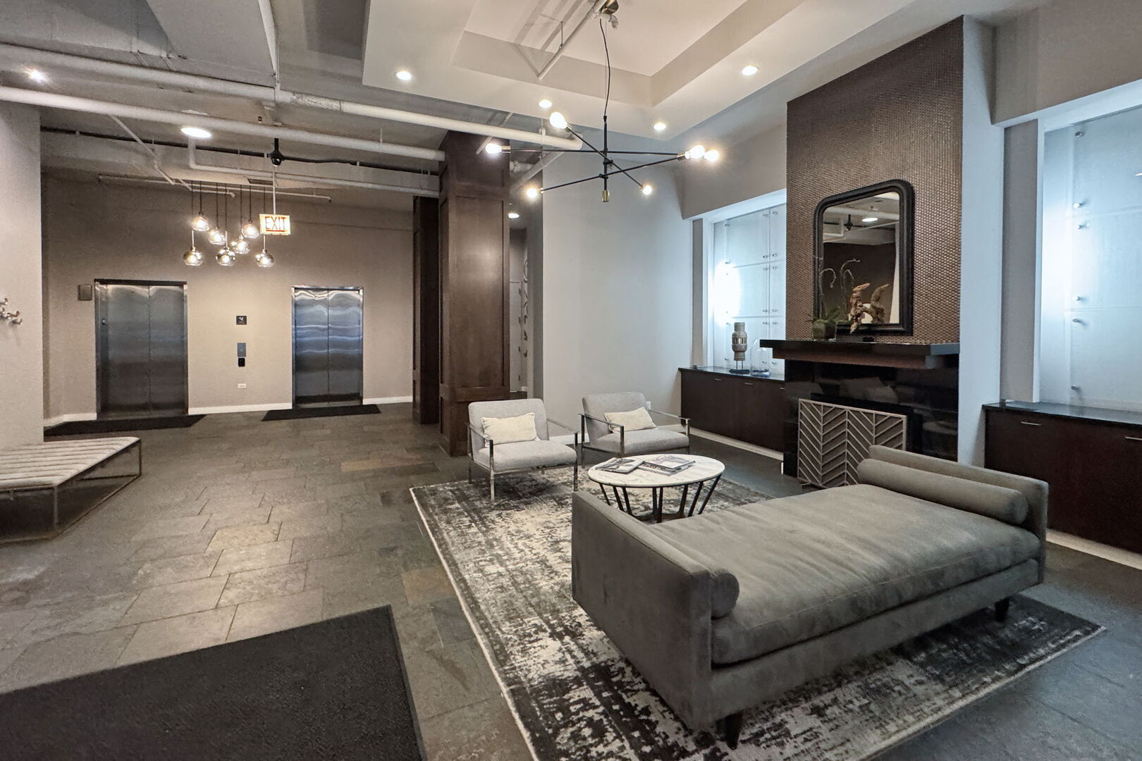 901 West Madison Street, Unit 603 Chicago, IL 60607 - Photo 19 of 25 a living room with furniture and a chandelier