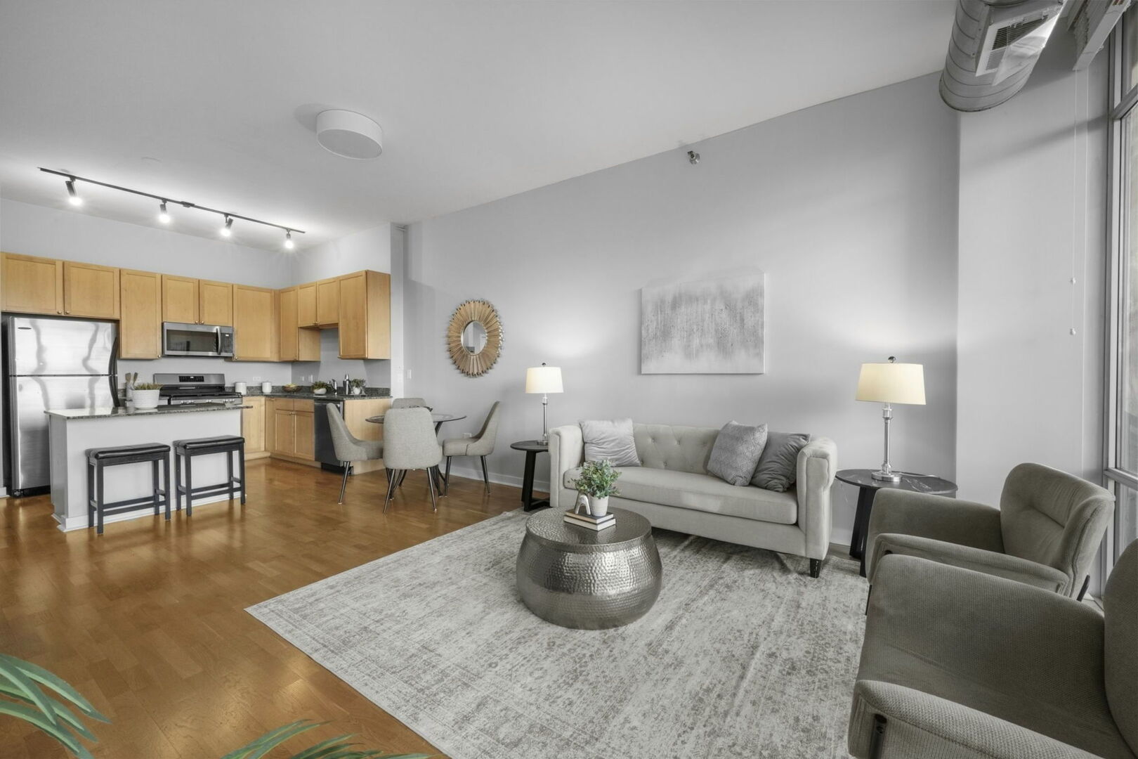 901 West Madison Street, Unit 603 Chicago, IL 60607 - Photo 6 of 25 a living room with furniture and kitchen view