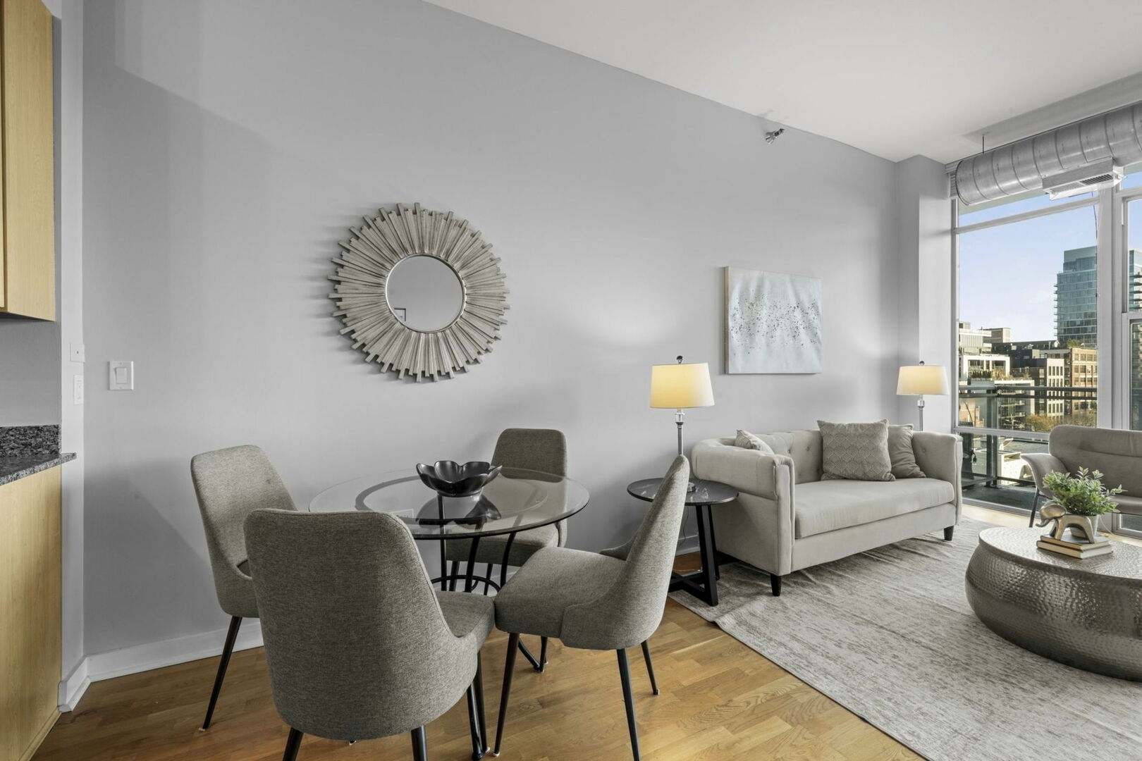 901 West Madison Street, Unit 603 Chicago, IL 60607 - Photo 10 of 25 a living room with furniture and a wooden floor