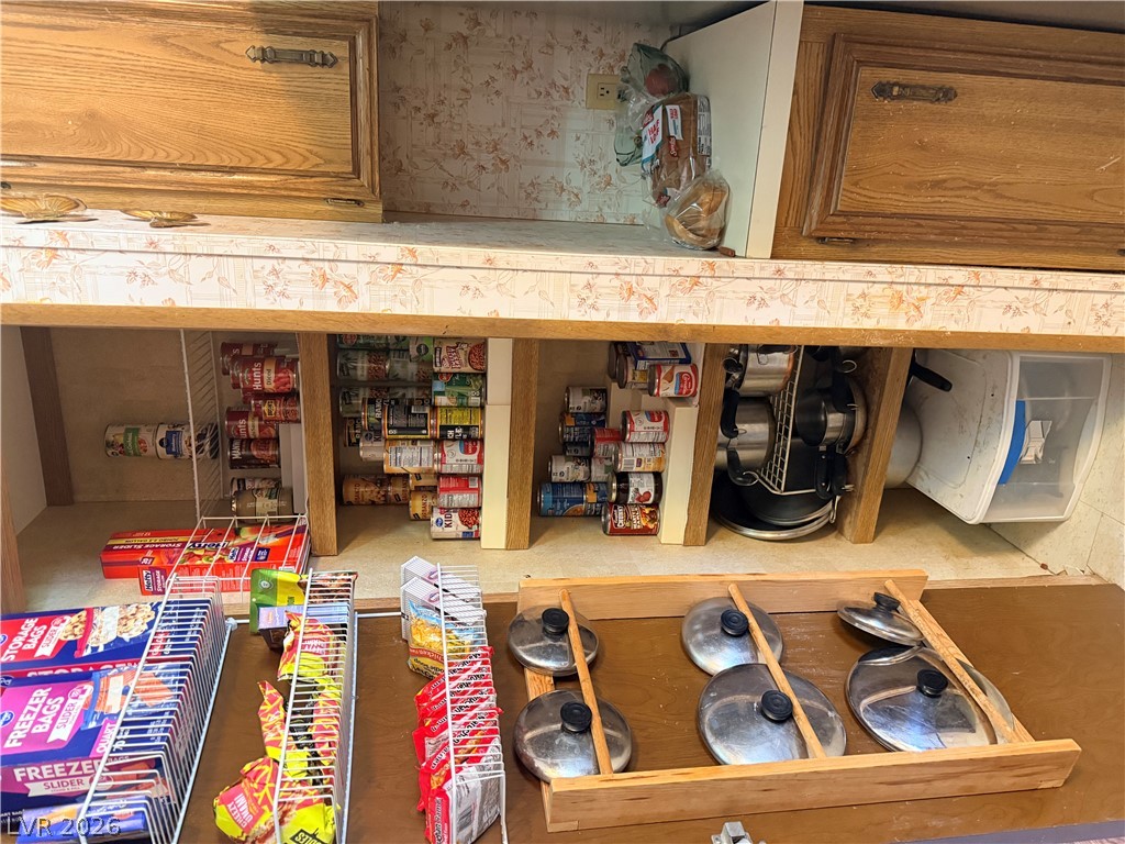 1391 West Dyer Road Pahrump, NV 89048 - Photo 45 of 50 An organized pantry offers efficient storage solutions for every culinary need.