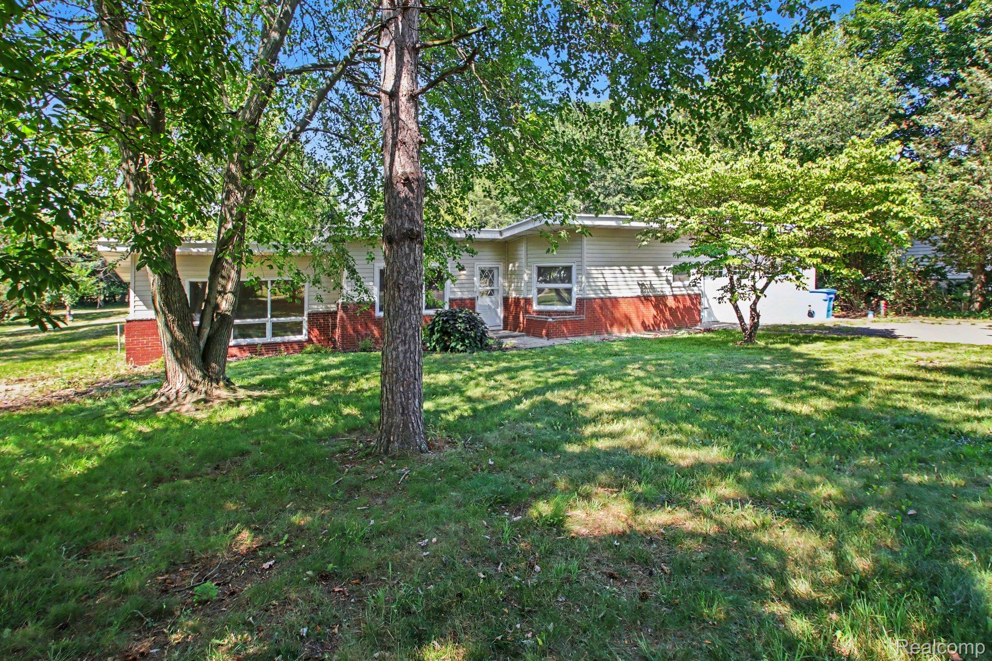 7800 Sharpe Road Fowlerville, MI 48836 - Photo 19 of 22 Charming ranch-style home set on a spacious lot with mature shade trees and expansive manicured lawn
