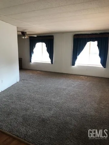 an empty room with a fireplace