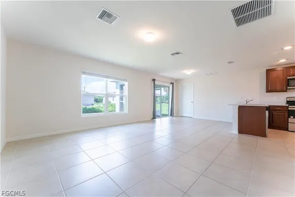 a view of an empty room with a window