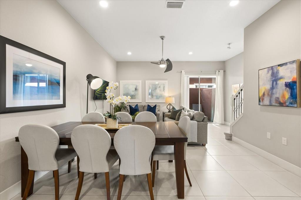2637 Sunrise Shores Drive Kissimmee, FL 34747 - Photo 12 of 39 a view of a dining room with furniture