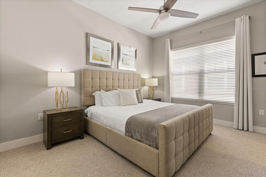 2637 Sunrise Shores Drive Kissimmee, FL 34747 - Photo 15 of 39 a bedroom with a bed and a window