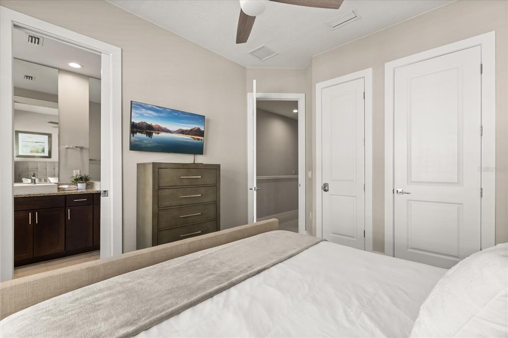 2637 Sunrise Shores Drive Kissimmee, FL 34747 - Photo 16 of 39 a bedroom with a bed and a bathroom