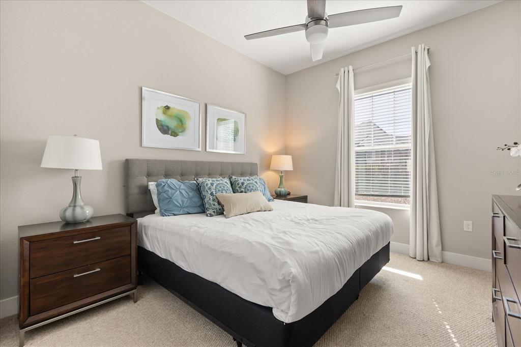 2637 Sunrise Shores Drive Kissimmee, FL 34747 - Photo 18 of 39 a bedroom with a bed and a window