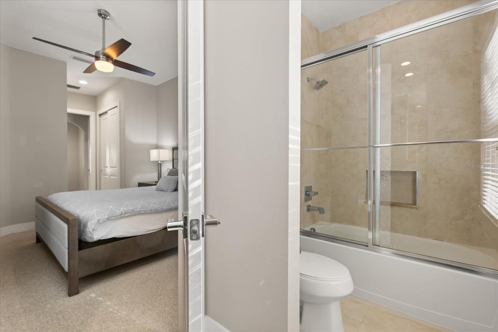 2637 Sunrise Shores Drive Kissimmee, FL 34747 - Photo 22 of 39 a bathroom with a sink a toilet and shower