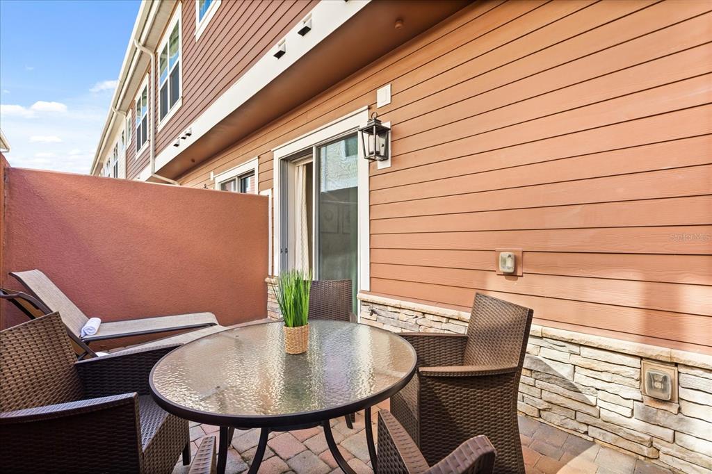 2637 Sunrise Shores Drive Kissimmee, FL 34747 - Photo 30 of 39 a view of backyard of house and seating area