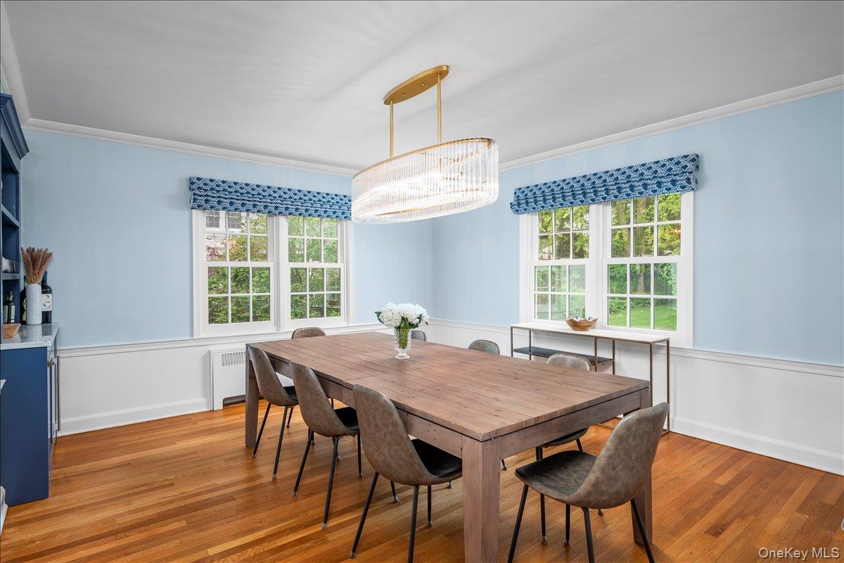 49 Eton Road Larchmont, NY 10538 - Photo 9 of 34 a view of a dining room with furniture wooden floor and a chandelier