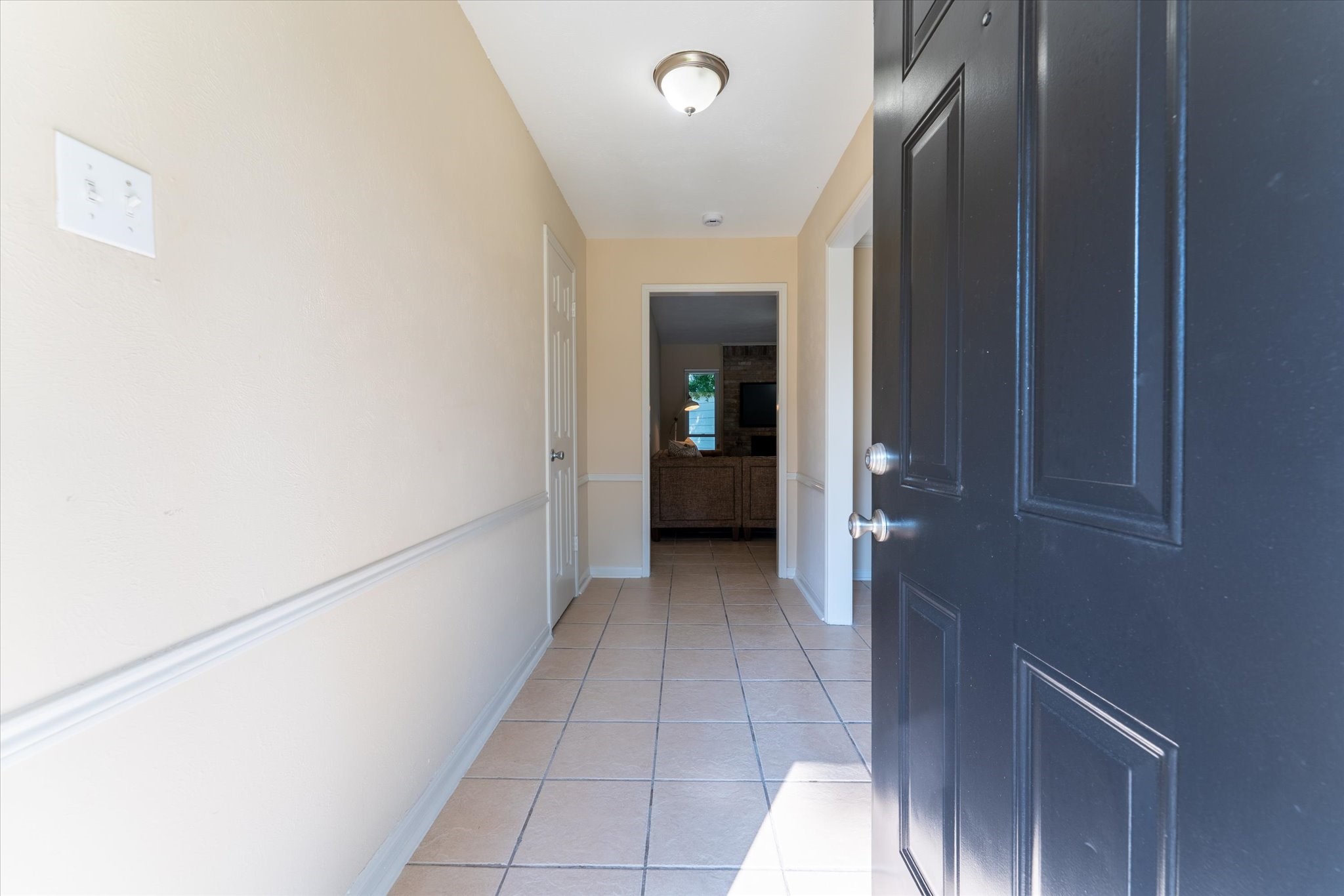 25019 Barmby Drive Spring, TX 77389 - Photo 11 of 43 a view of a hallway with wooden shelves