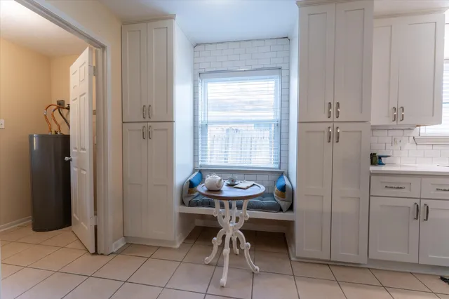 a kitchen with a cabinets and a refrigerator