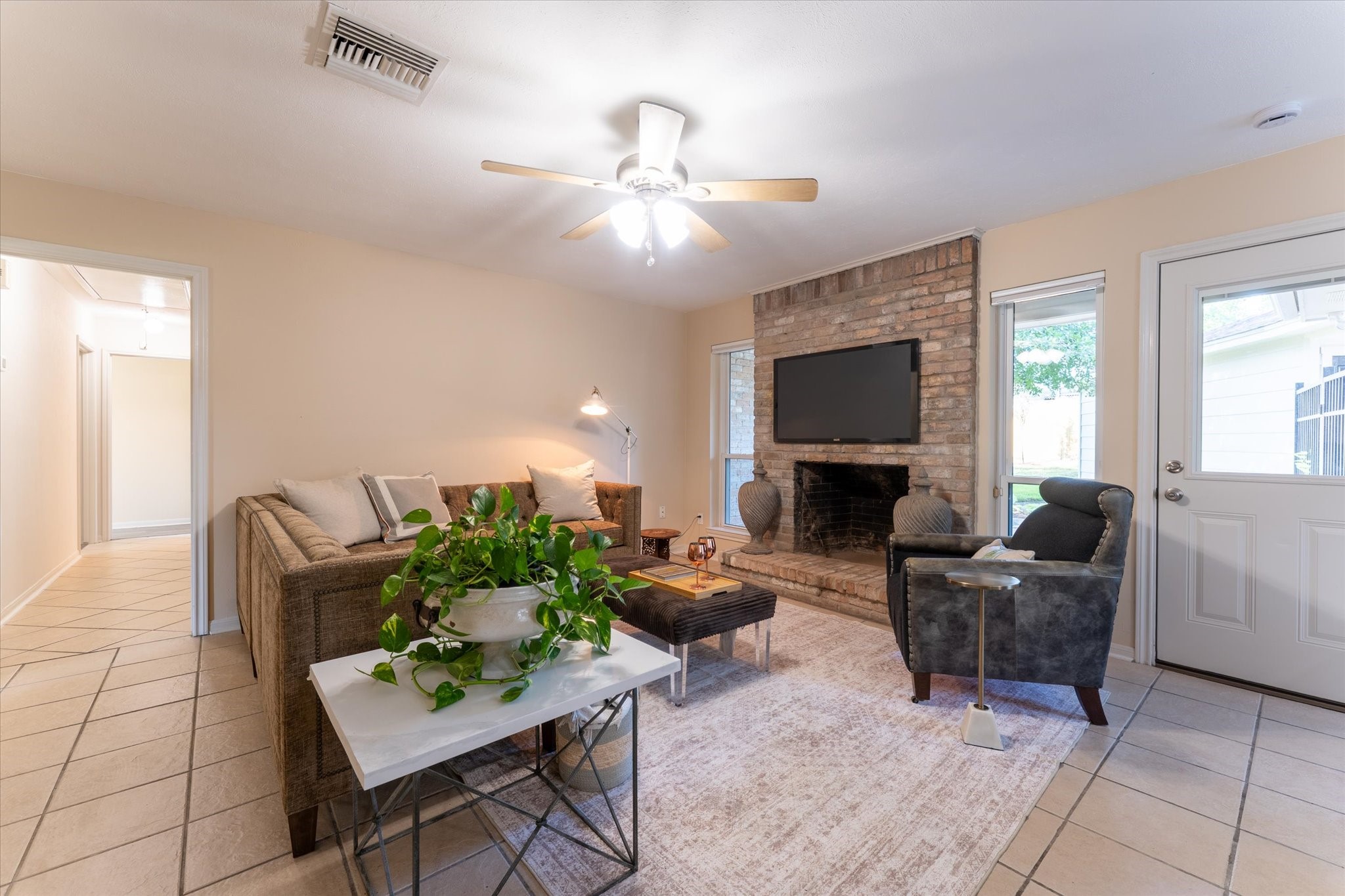 25019 Barmby Drive Spring, TX 77389 - Photo 18 of 43 a living room with furniture and a flat screen tv