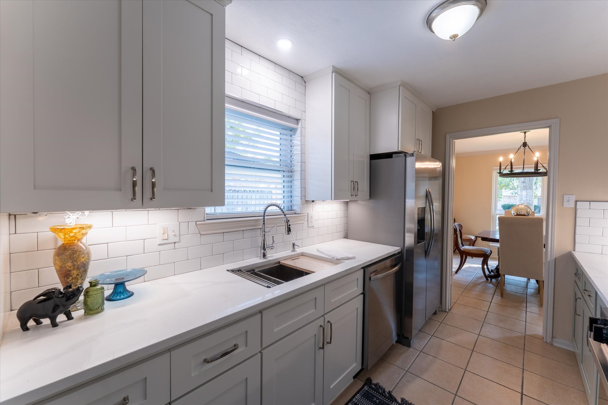 25019 Barmby Drive Spring, TX 77389 - Photo 25 of 43 a kitchen with stainless steel appliances granite countertop a sink and a refrigerator