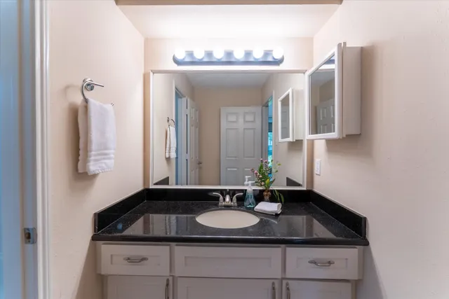 a white toilet sitting next to a bath tub
