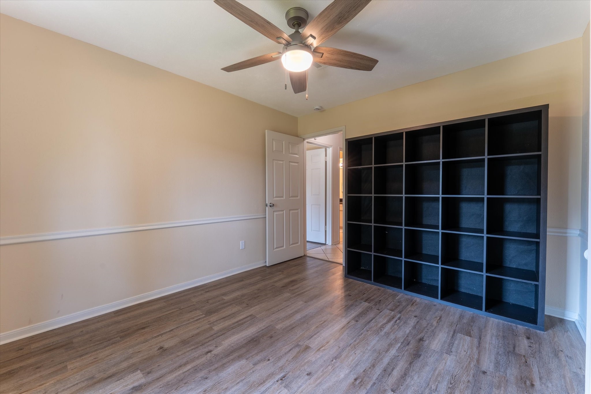 25019 Barmby Drive Spring, TX 77389 - Photo 29 of 43 a view of an empty room with a window and wooden floor