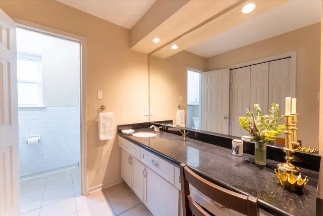 a bathroom with a sink double vanity and a mirror