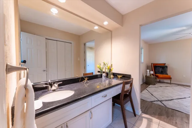 a bathroom with a shower and a sink